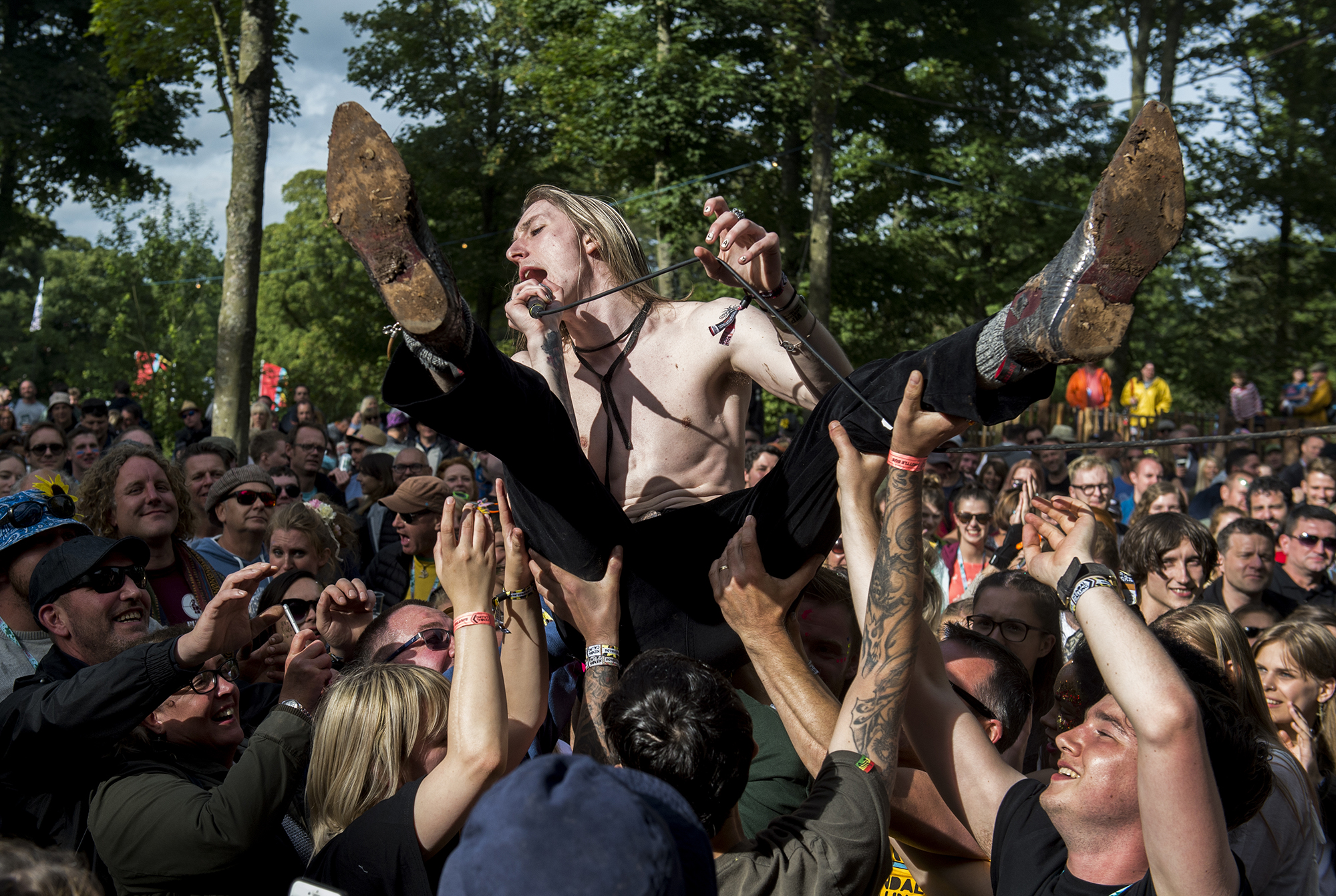 KENDAL, ENGLAND - JULY 28: Fred Farrell, lead singer of Saytr Play, crowd surfs during their performane on the Woodland stage at Kendal Calling Festival at Lowther Deer Park on July 28, 2017 in Kendal, England. (Photo by Visionhaus/Corbis via Getty Images)